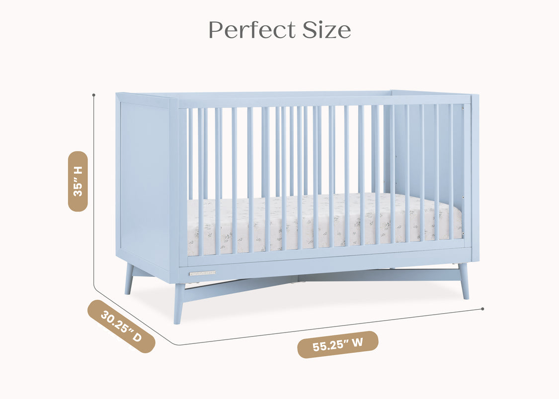 Blue crib with dimensions indicated on a white background