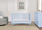 Nursery with light blue crib and dresser against a white paneled wall. 35-Dylan 4-in-1 Convertible Crib