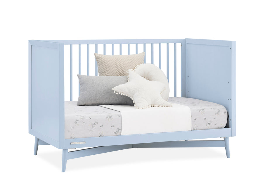 Light blue crib with bedding and pillows on a white background 27-Dylan 4-in-1 Convertible Crib