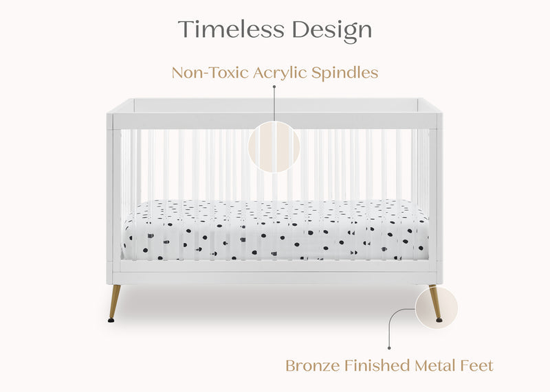 White crib with polka dot mattress cover on a white background, featuring text about design and materials. 16-Sloane 4-in-1 Acrylic Convertible Crib