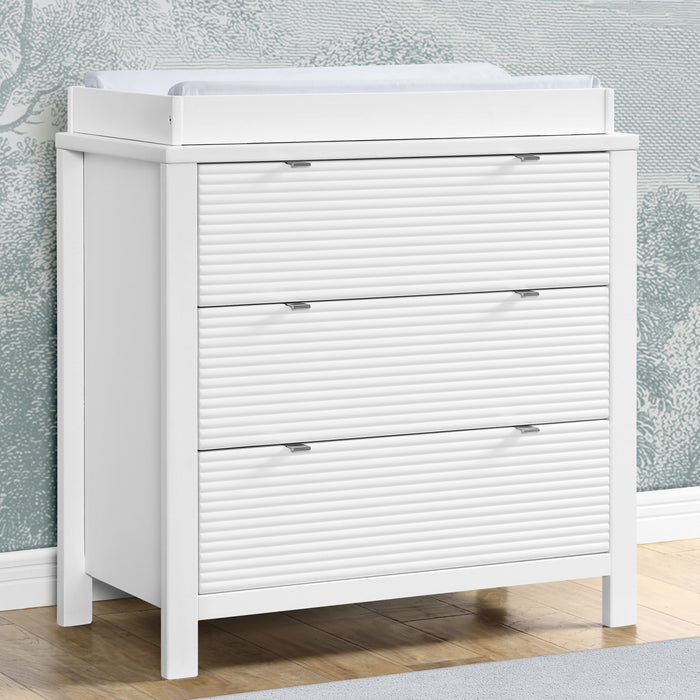W189030 130 Cassie Dresser Bianca White Lifestyle 101 1-Cassie 3 Drawer Dresser with Changing Top