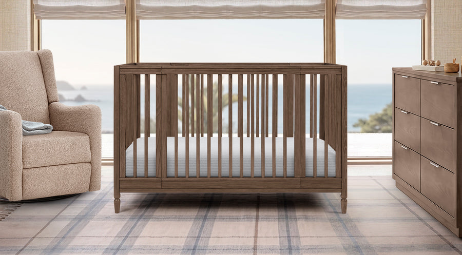 Wooden crib in a room with a view of water and trees 1-Jalen Grow With Me Collection