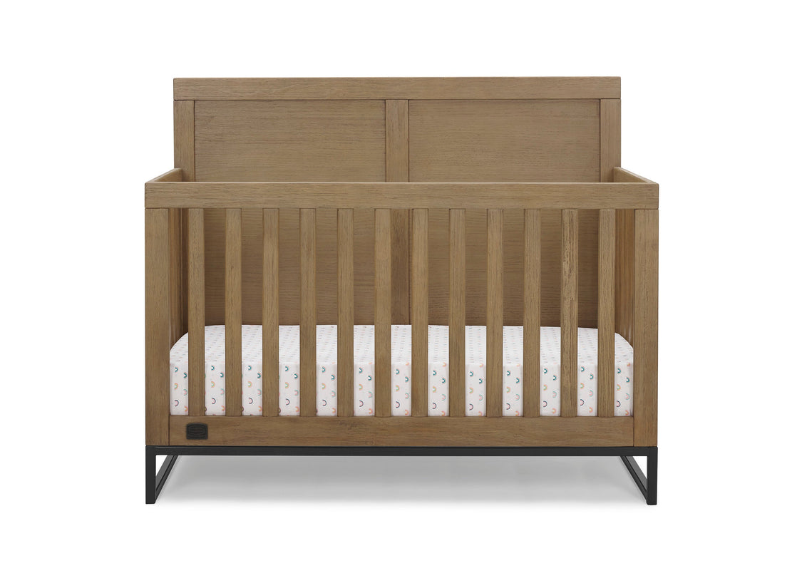 Wooden crib with a white mattress on a white background