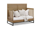 Wooden crib with white bedding and pillows on a white background 23-Foundry 6-in-1 Convertible Crib