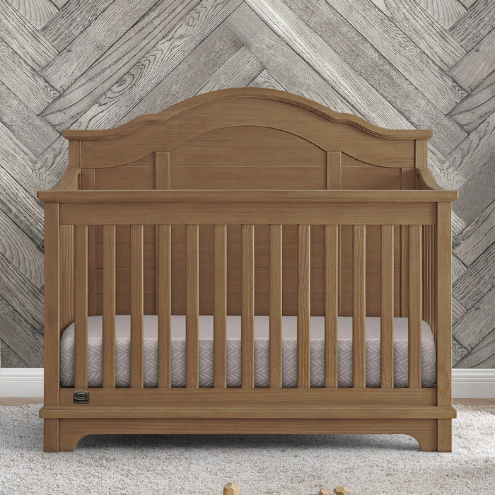 Wooden crib with a wooden wall background 2-Asher 6-in-1 Convertible Crib