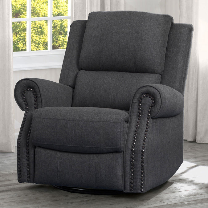 A beige upholstered recliner glider swivel chair with cushioned arms and nailhead trim, positioned in a nursery room. 12-Dylan Nursery Recliner Glider Swivel Chair