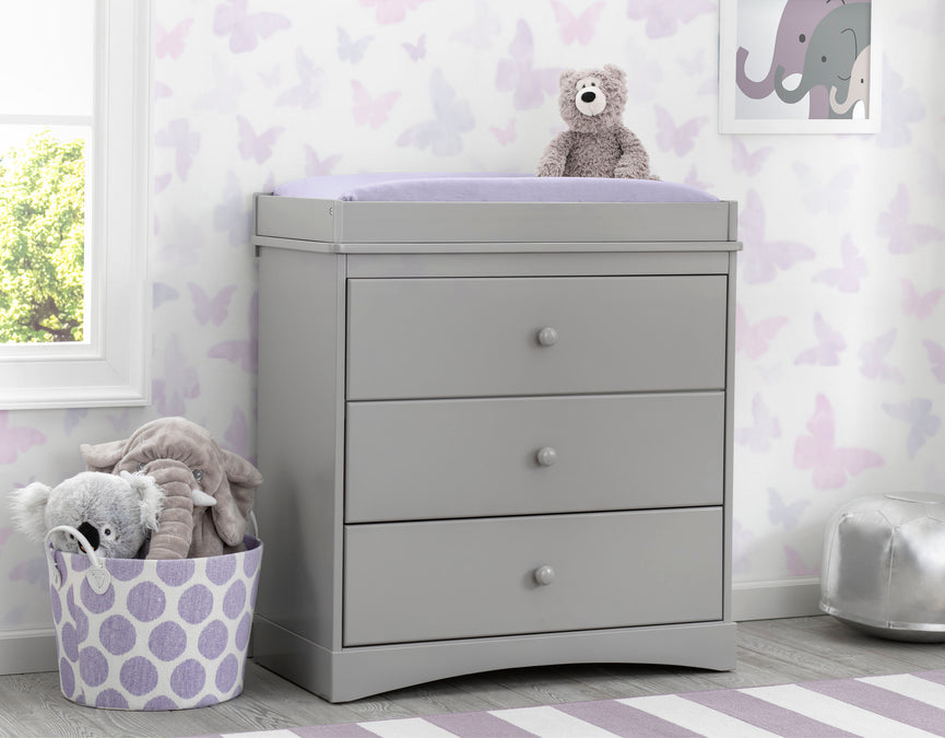W558430 026 skylar dresser grey lifestyle 04 8-Skylar 3 Drawer Dresser with Changing Top and Interlocking Drawers