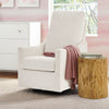 White armchair with a pink blanket next to a wooden side table in a room with pink walls and a window. 14-Andie Boucle Nursery Glider Swivel Chair