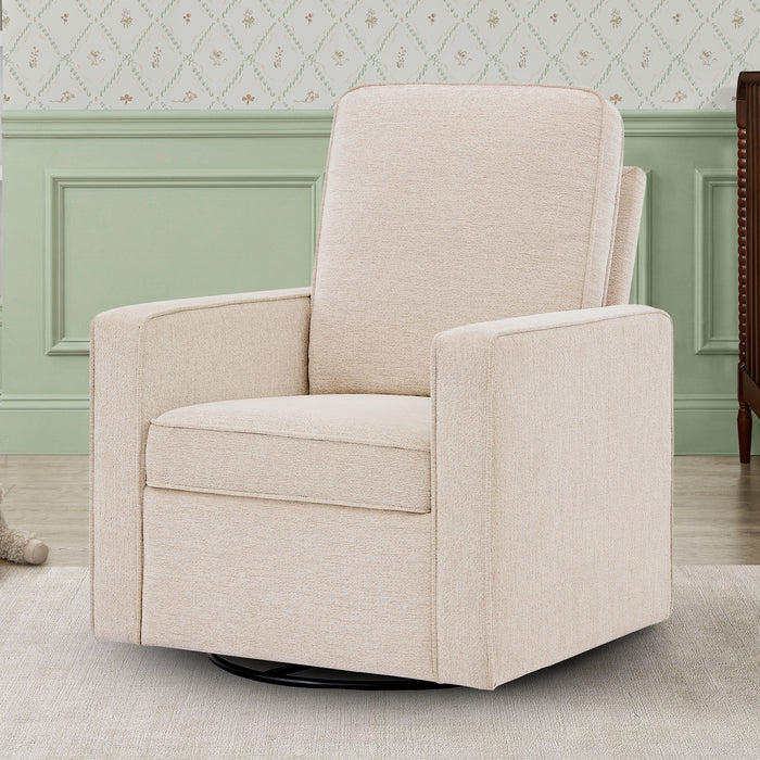 Beige swivel chair in a room with light green walls and patterned wallpaper. 0-Noah Upholstered Swivel Glider