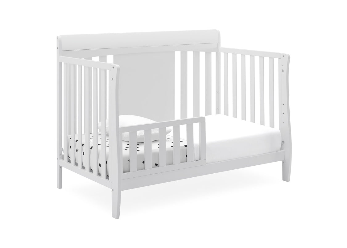 White crib with a mattress on a white background