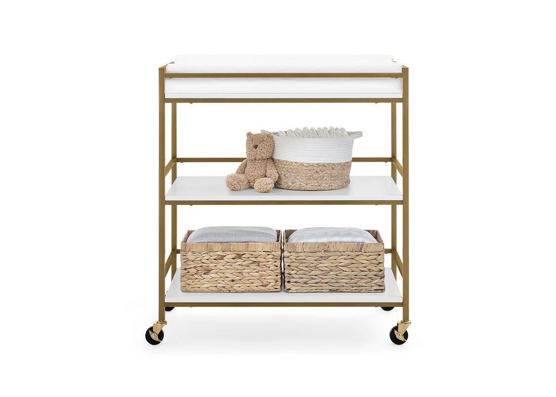 Baby changing table with shelves, basket, and teddy bear on a white background