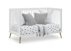 White crib with gray and white bedding on a white background 20-Sloane 4-in-1 Acrylic Convertible Crib