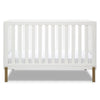 White crib with wooden legs on a white background 18-Hendrix 4-in-1 Convertible Crib