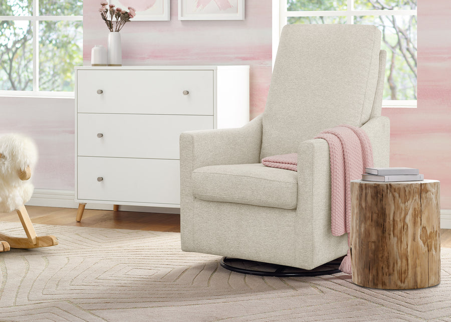 Beige recliner chair in a nursery with a wooden side table and pink accents. 27-Andie Nursery Glider Swivel Chair with LiveSmart Fabric