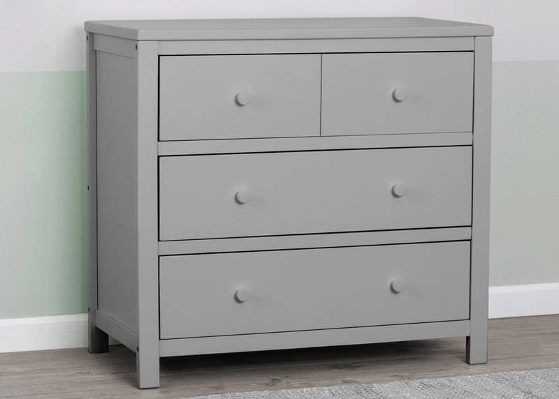 Gray dresser with four drawers on a wooden floor against a light green wall. 9-3 Drawer Dresser with Interlocking Drawers