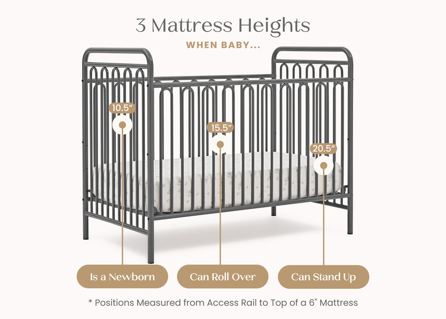 Baby crib with mattress height measurement labels on a white background 23-Darcy 4-in-1 Convertible Metal Crib