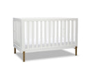 White crib with wooden legs on a white background 19-Hendrix 4-in-1 Convertible Crib