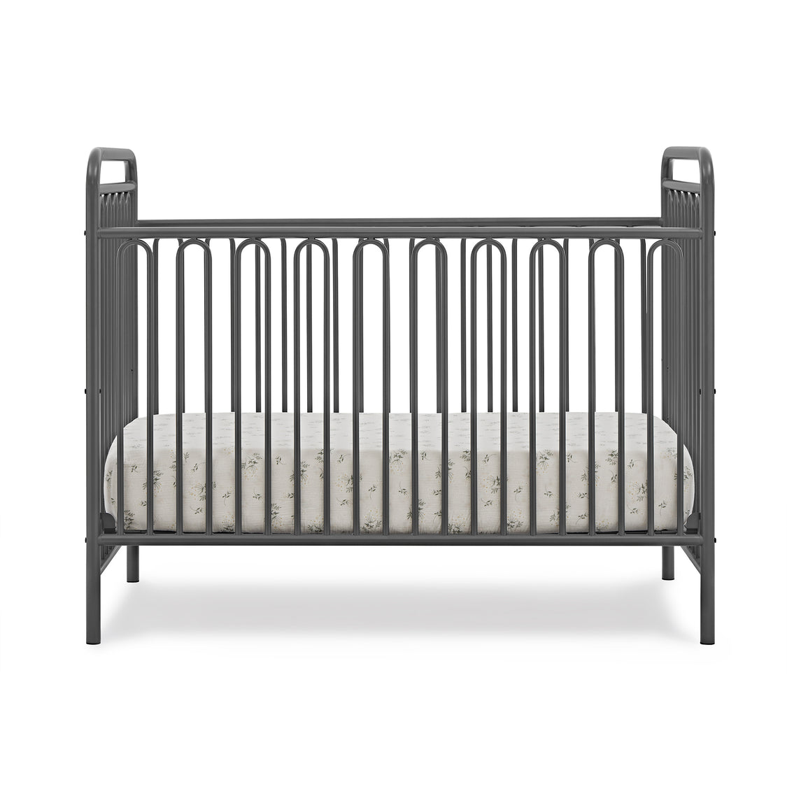 Black crib with white crib sheet on a white background
