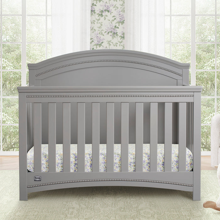 Gray crib in a room with large windows and floral curtains 0-Emma Crib 'N' More