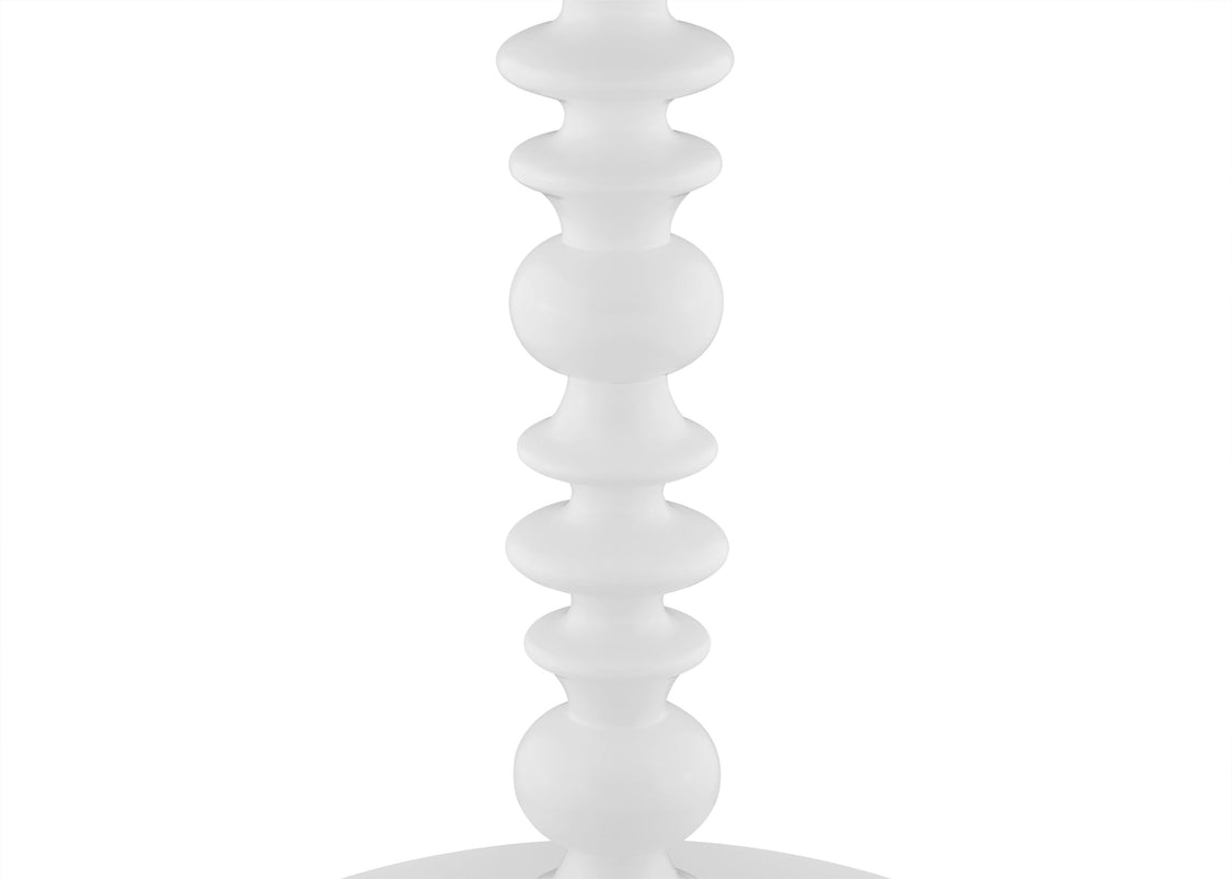White decorative object with a spiral design on a white background