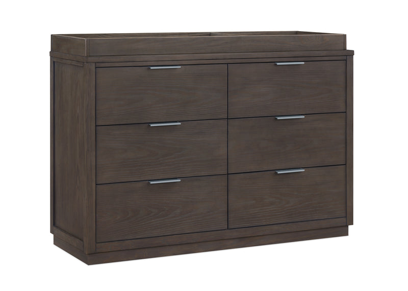 Dark wood dresser with four drawers on a white background