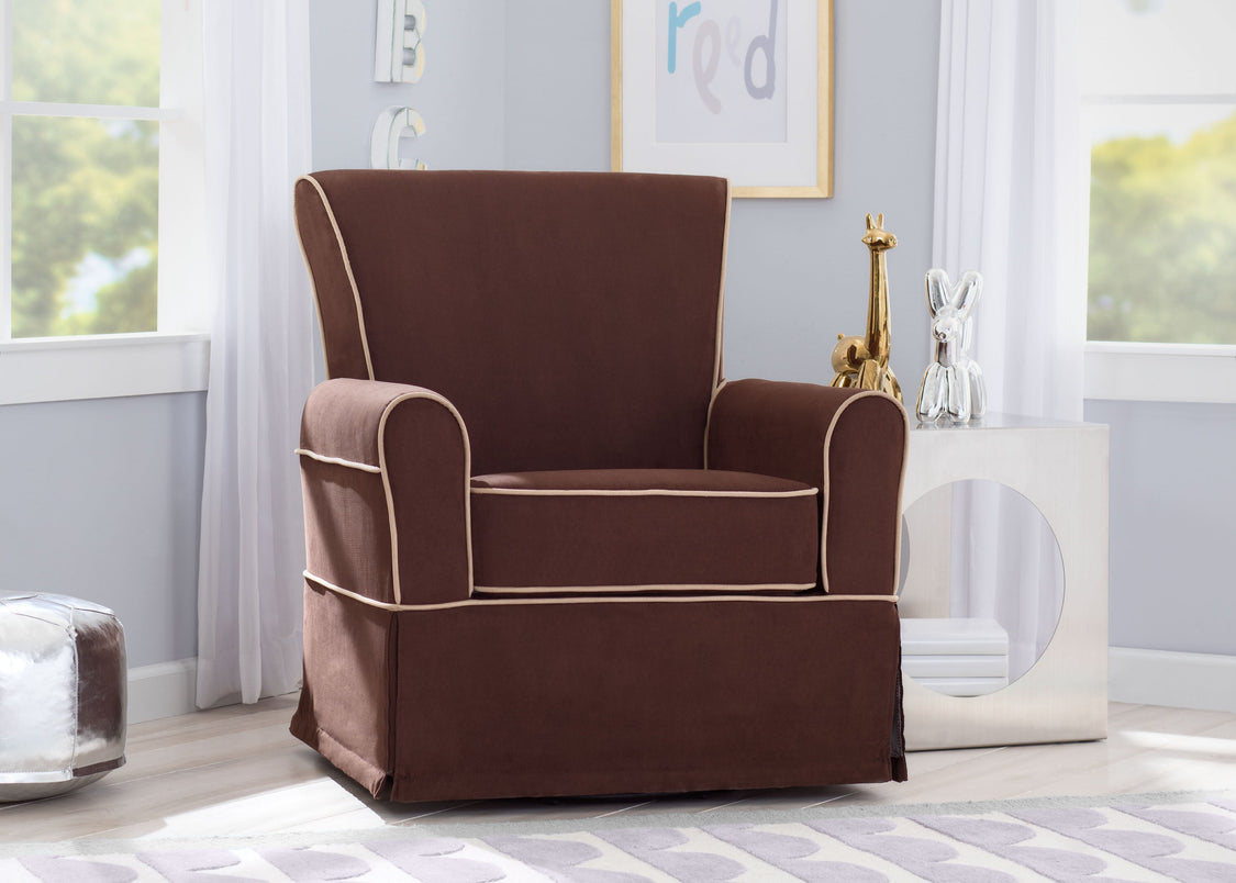 Brown armchair in a room with light blue walls and large windows.