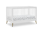 White crib with a polka dot mattress on a white background 24-Sloane 4-in-1 Acrylic Convertible Crib