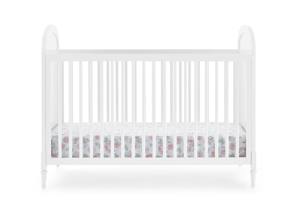 White crib with floral bedding on a white background
