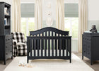 Nursery room with black crib, dresser, and chair with checkered pattern. 26-Farmhouse 6-in-1 Convertible Baby Crib
