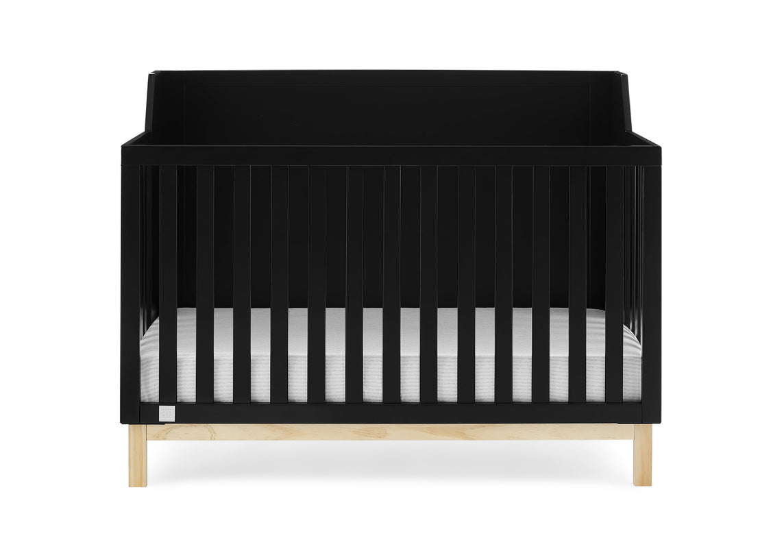 Black crib with white and gray striped mattress on a white background