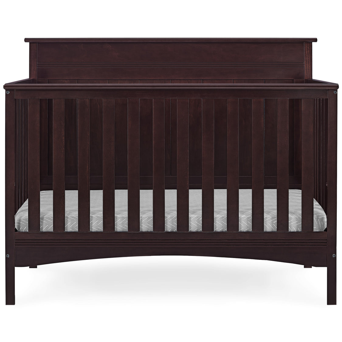 Dark wood crib with mattress on a white background