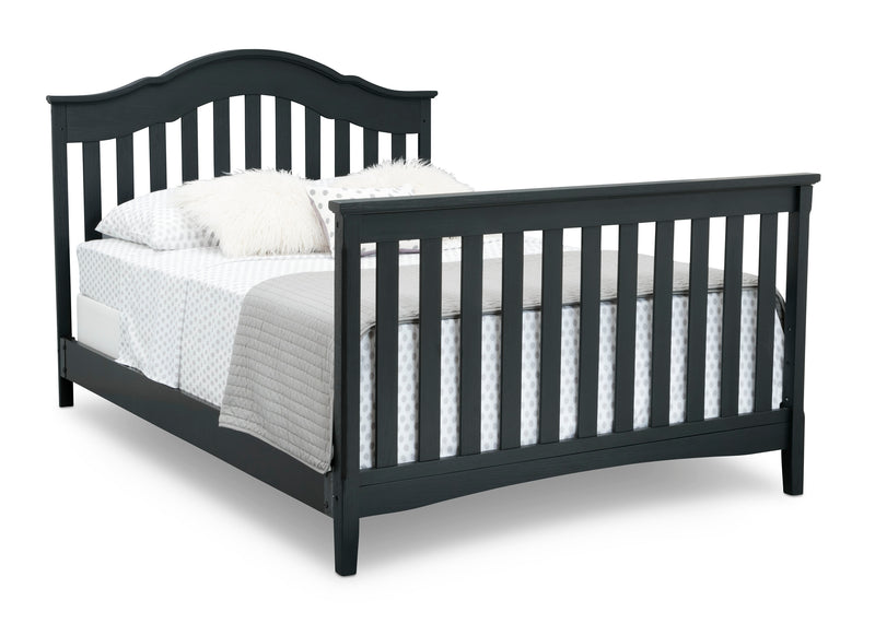 Black bed frame with white bedding on a white background