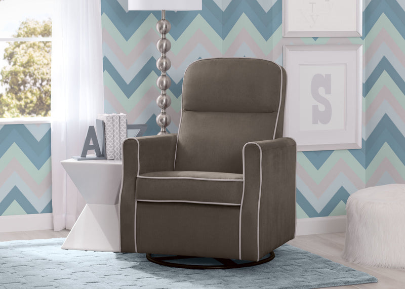 Gray recliner chair in a room with colorful zigzag wallpaper