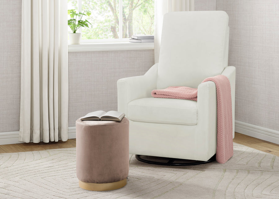 White recliner chair with a pink blanket in a room with a window and curtains. 13-Andie Nursery Glider Swivel Chair with LiveSmart Fabric