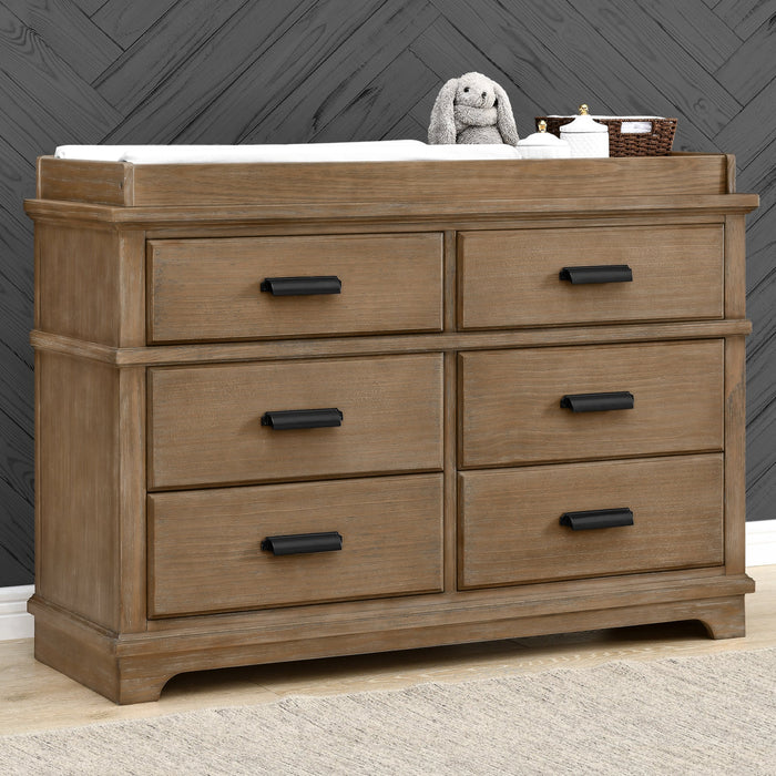 A gray Asher 6 Drawer Dresser with a changing top and sleek matte black metal cup handles. 0-Asher 6 Drawer Dresser with Changing Top and Interlocking Drawers