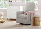 Gray recliner chair with a pink blanket in a nursery setting. 23-Andie Nursery Glider Swivel Chair with LiveSmart Fabric