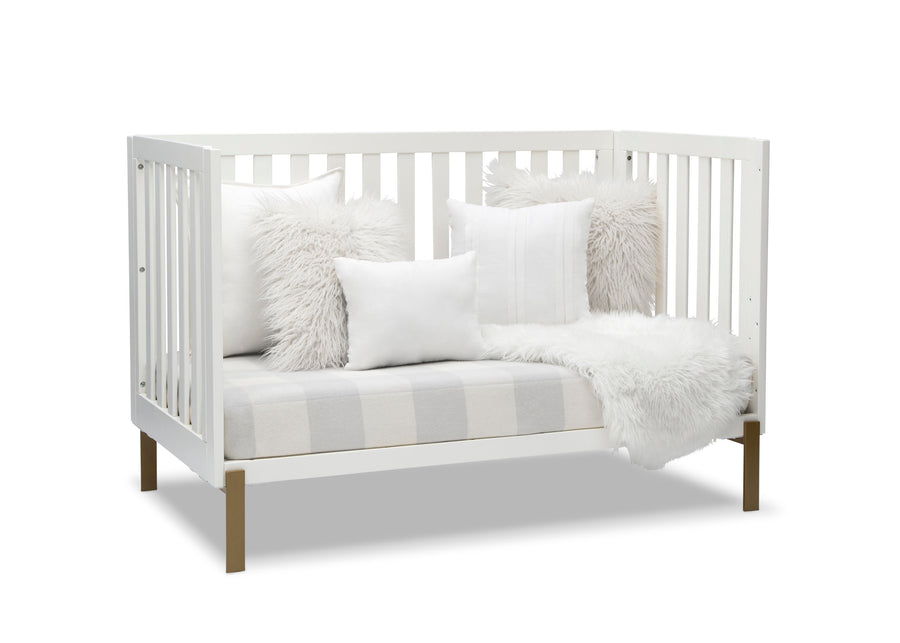 White crib with wooden legs, white bedding, and gray and white striped blanket on a white background 22-Hendrix 4-in-1 Convertible Crib