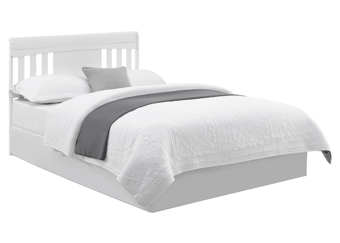 White bed with gray bedding on a white background