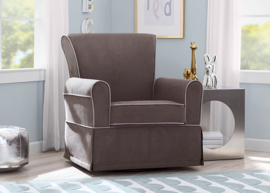 Gray armchair in a room with light blue walls and decorative items.