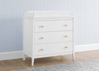 White dresser with gold knobs against a light blue wall with subtle pattern 12-Casey 3 Drawer Dresser with Interlocking Drawers