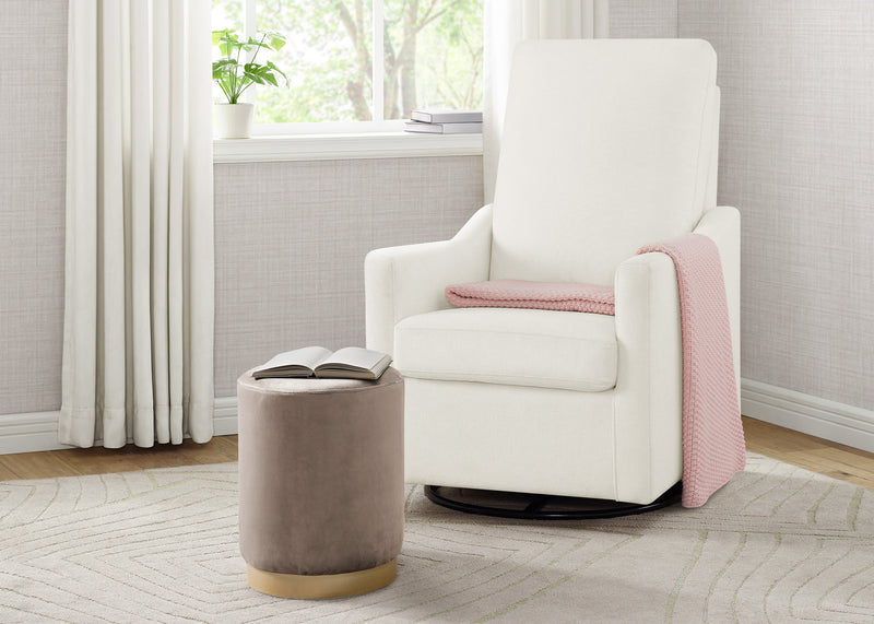 White armchair with a pink blanket in a room with light gray walls and a window. 33-Andie Nursery Glider Swivel Chair with LiveSmart Fabric