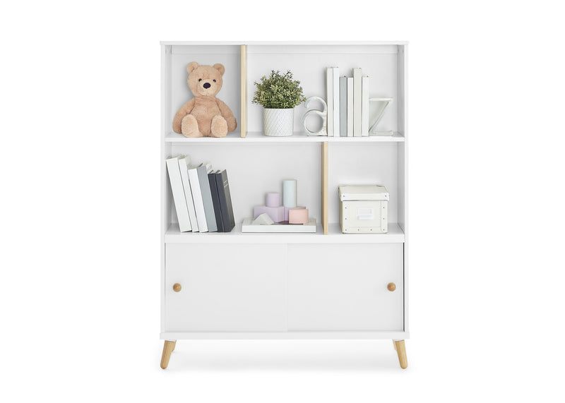 White bookshelf with decorative items on a white background