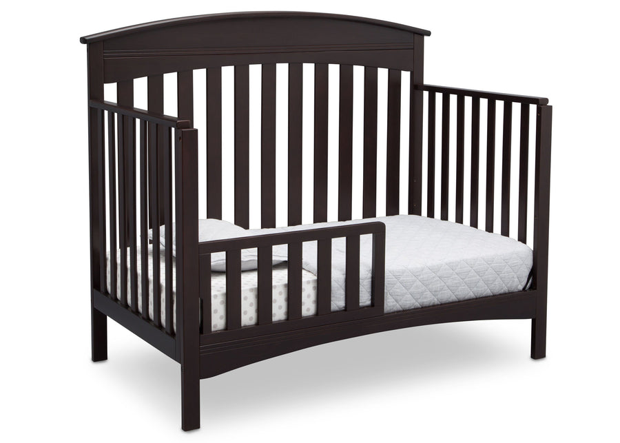 Delta Children Dark Espresso (958) Bennington Elite Arched 4-in-1 Convertible Crib, Toddler Bed Angle, c4c 16-Bennington Elite Arched 4-in-1 Convertible Crib