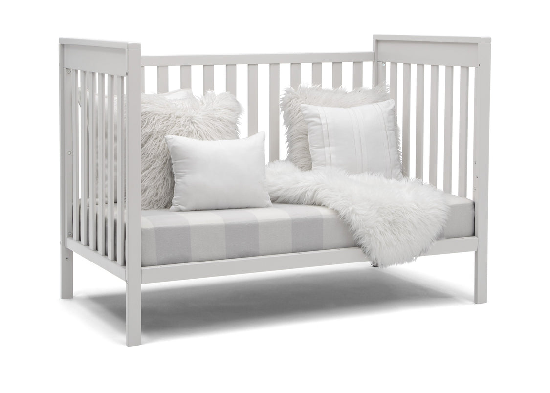 Delta Children Bianca White (130) Mercer 6-in-1 Convertible Crib, Right Sofa Silo View