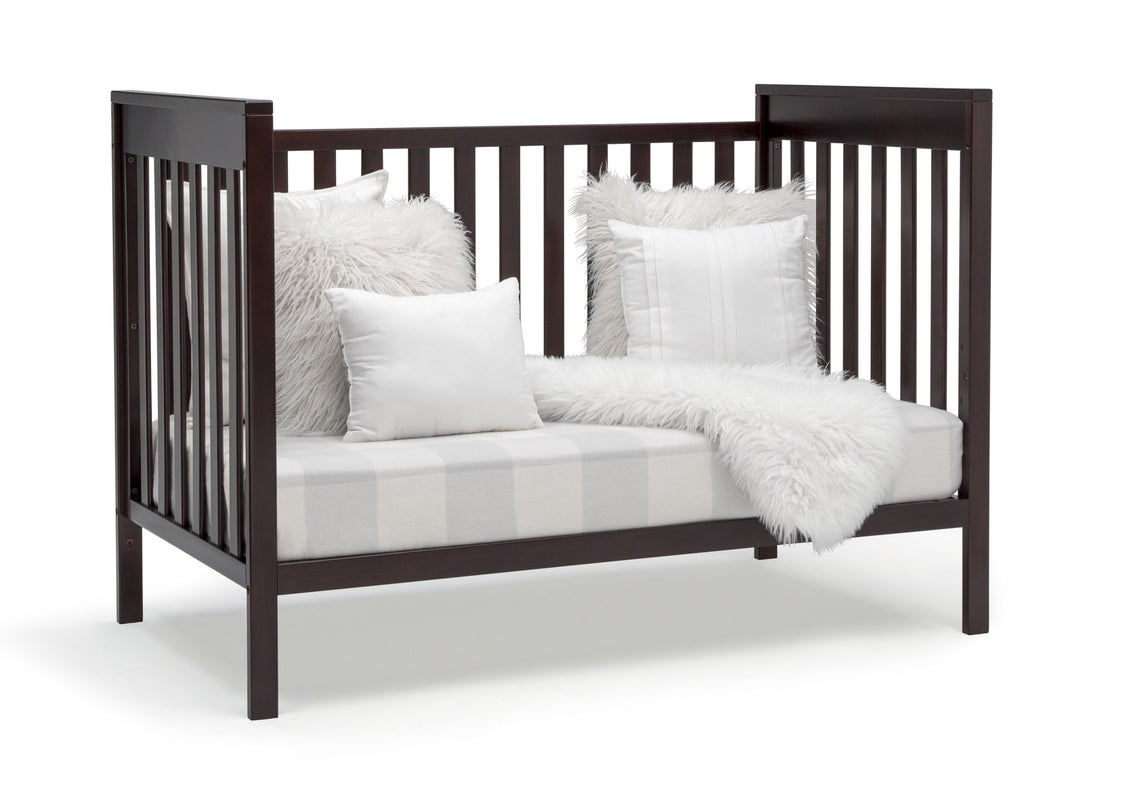 Delta Children Dark Chocolate (207) Mercer 6-in-1 Convertible Crib, Right Sofa Silo View